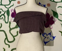 a mannequin mannequin wearing a plaid top