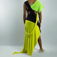 the back of a woman in a yellow and black dress