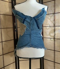 a mannequin with a denim top on it