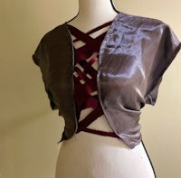 a mannequin with a brown and maroon top