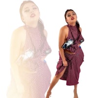 a woman in a plaid dress posing for a photo