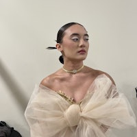 a woman in a tulle dress is posing for a photo
