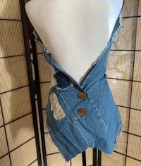 a mannequin with a denim top on it