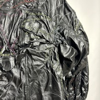 a black leather jacket with colorful stitching