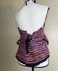 a mannequin with a purple and black striped top