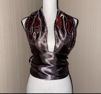 a mannequin mannequin wearing a black and red dress