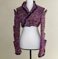 a mannequin mannequin wearing a pink and black sweater