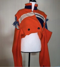 an orange and blue jacket on a mannequin