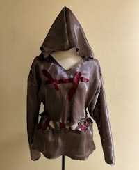 a brown and red hoodie on a mannequin