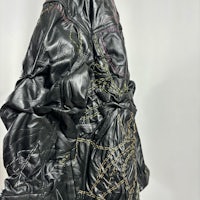 a black leather jacket on a mannequin